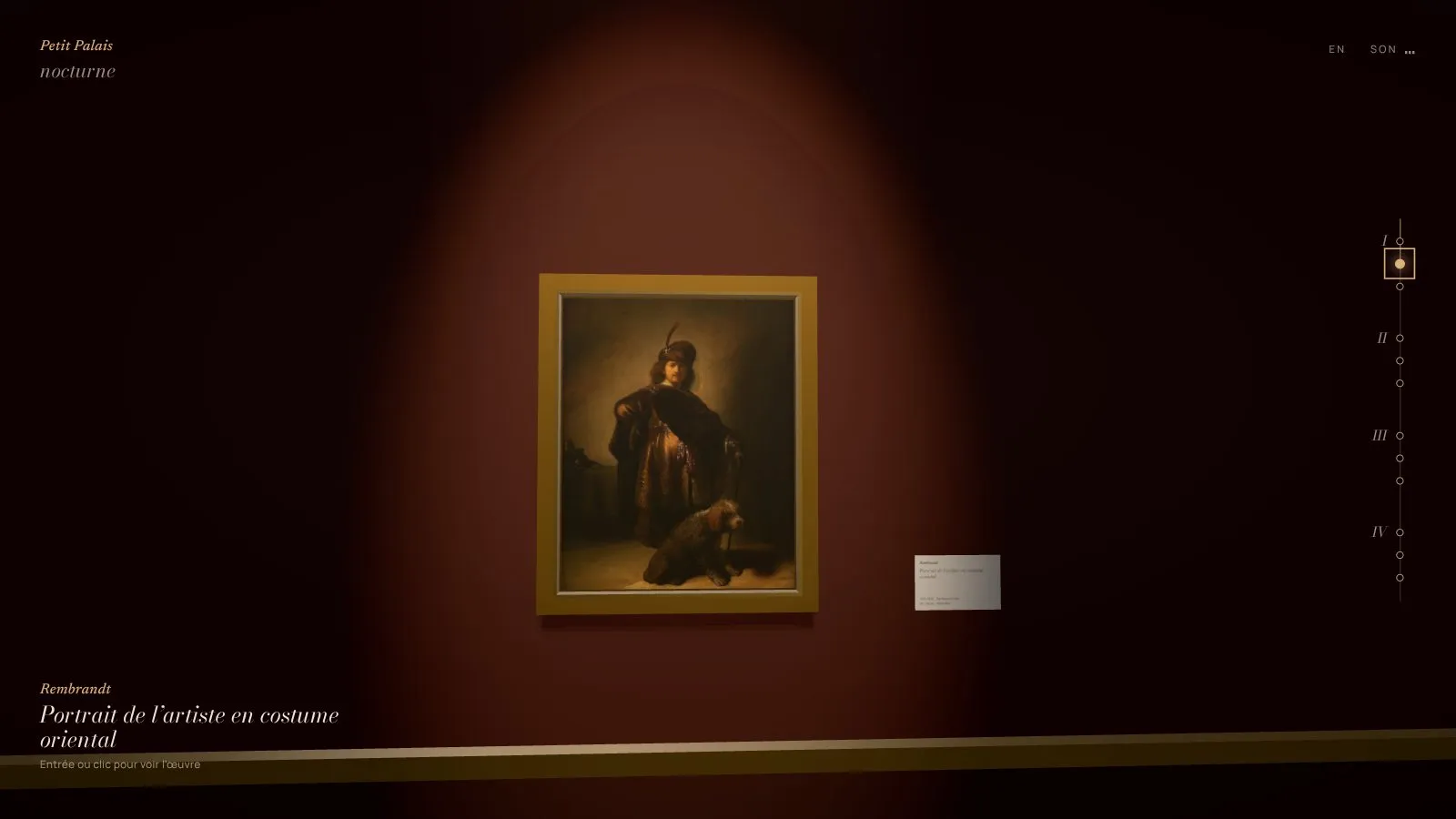 L'autoportrait de Rembrandt en costume oriental sous son projecteur, avec son cartel au mur